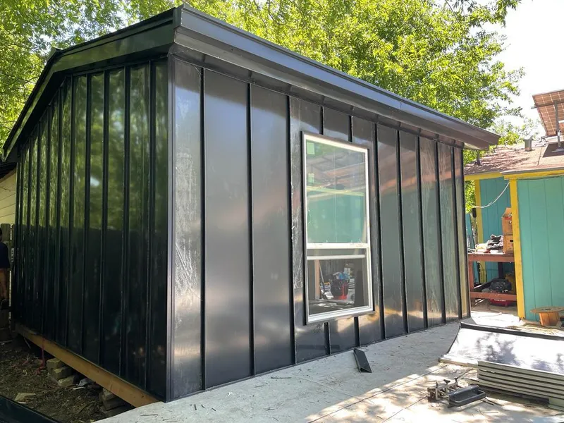 Black standing seam metal wall panels for Roof Inspection in Lochbuie