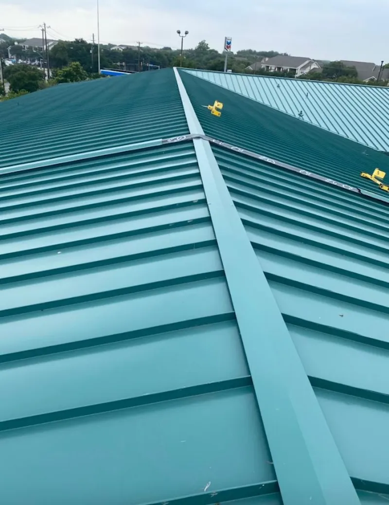 Green commercial metal roof ridge and valley for Metal Roof Repair in Lochbuie